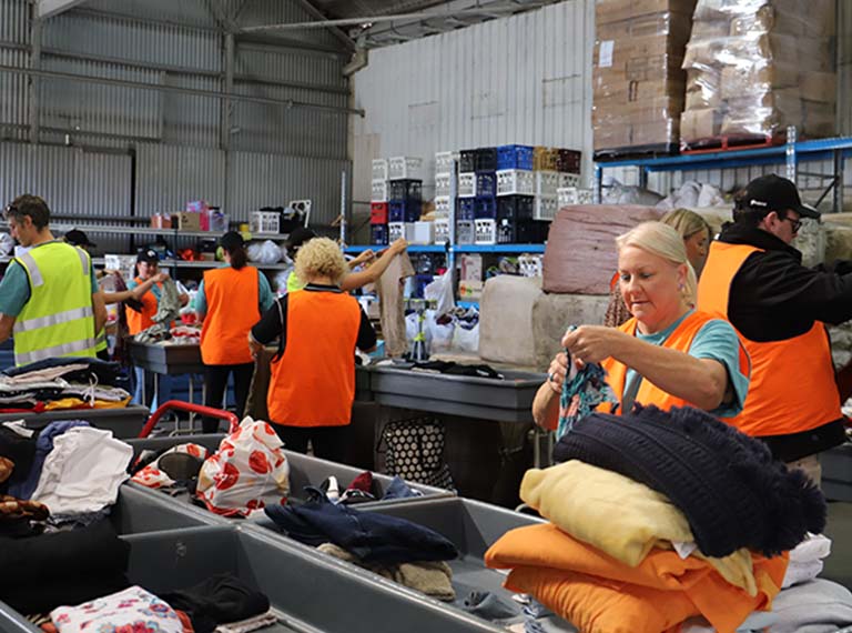 Newcastle Permanent staff helping to sort Lifeline donations.