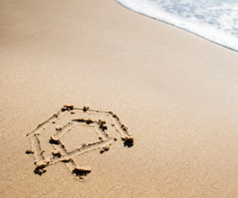 Logo drawn in the sand