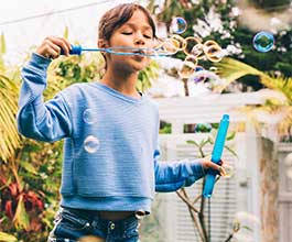 Girl blowing bubbles