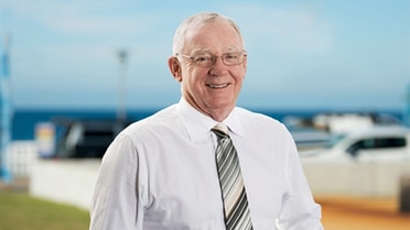 Newcastle Permanent Charitable Foundation - Michael Slater smiling by the beach