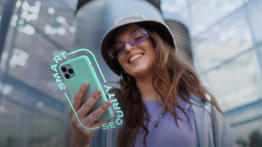 woman holding phone with smart security logo
