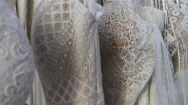 White dresses lined up
