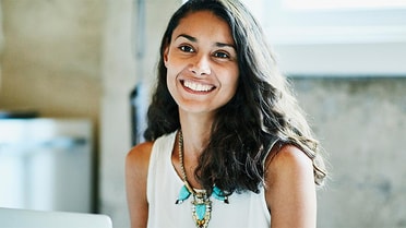 Woman in white shirt smiles 