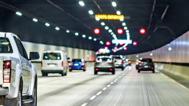 Cars driving under tunnel
