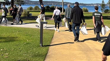 Alongside Newcastle Permanent people pick up trash