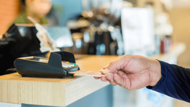 Man inserts card into machine