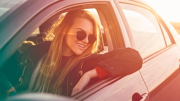 woman in car looking out window