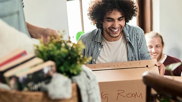 Renter carrying moving boxes