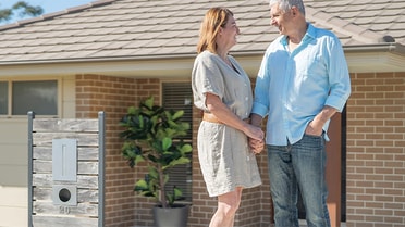 Couple out the front of modern australian home