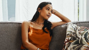 Woman looking sad on couch