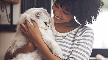 Lady cuddling cat