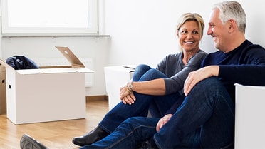 Elderly couple sitting on couch