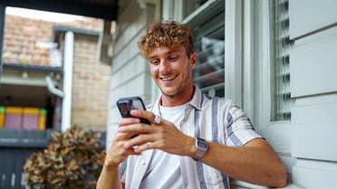 Man on mobile phone using banking app