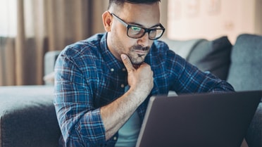 middle aged man on computer