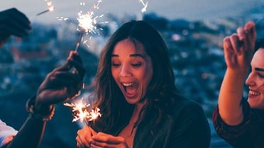Friends lighting fireworks 