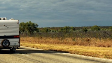 Caravan driving through country road
