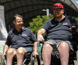 Two men in wheelchairs