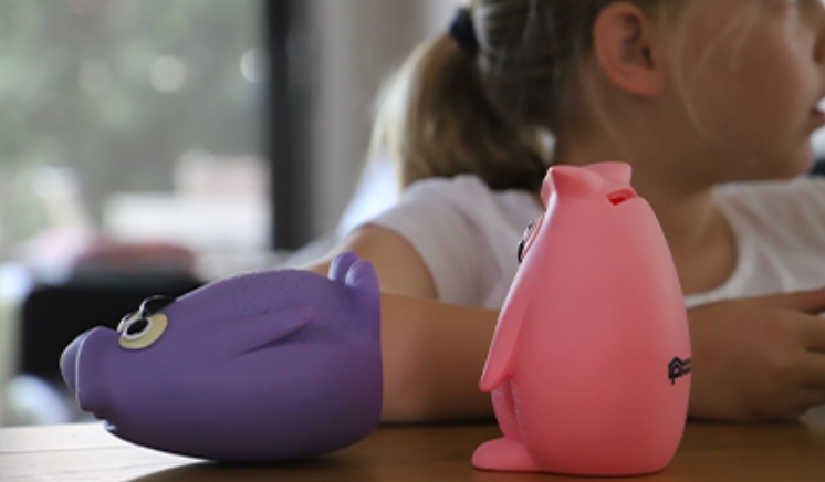 Child with two piggy banks